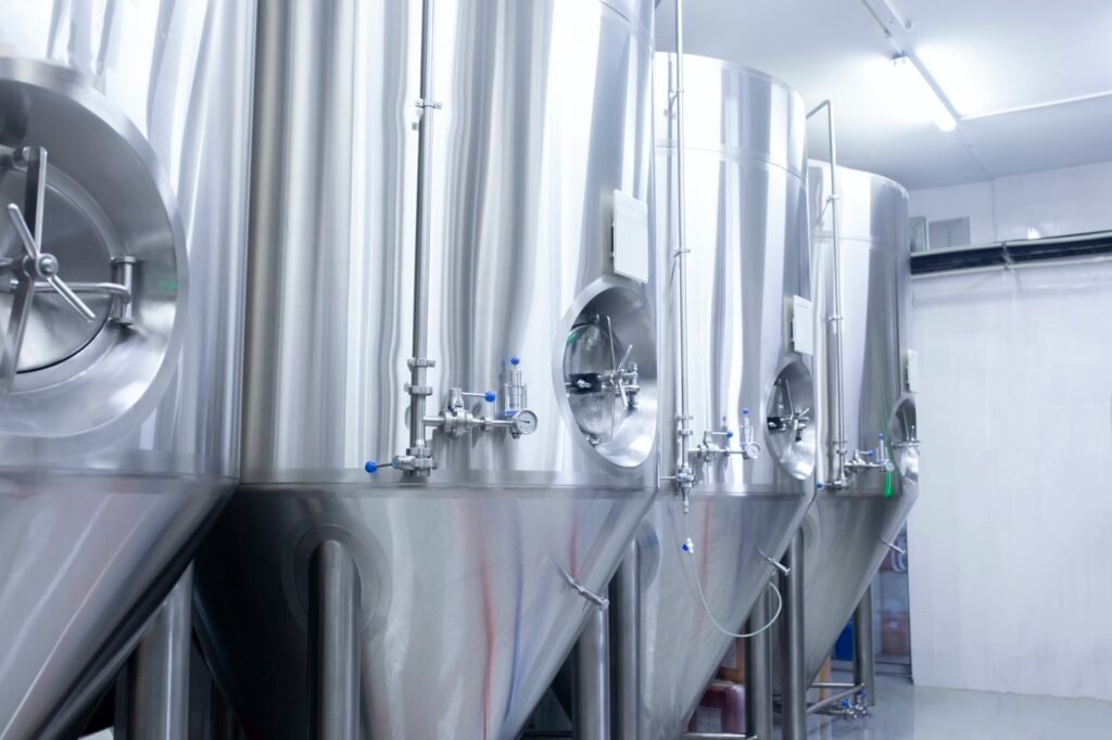 a warehouse of stainless steel tanks on the alcohol production factory